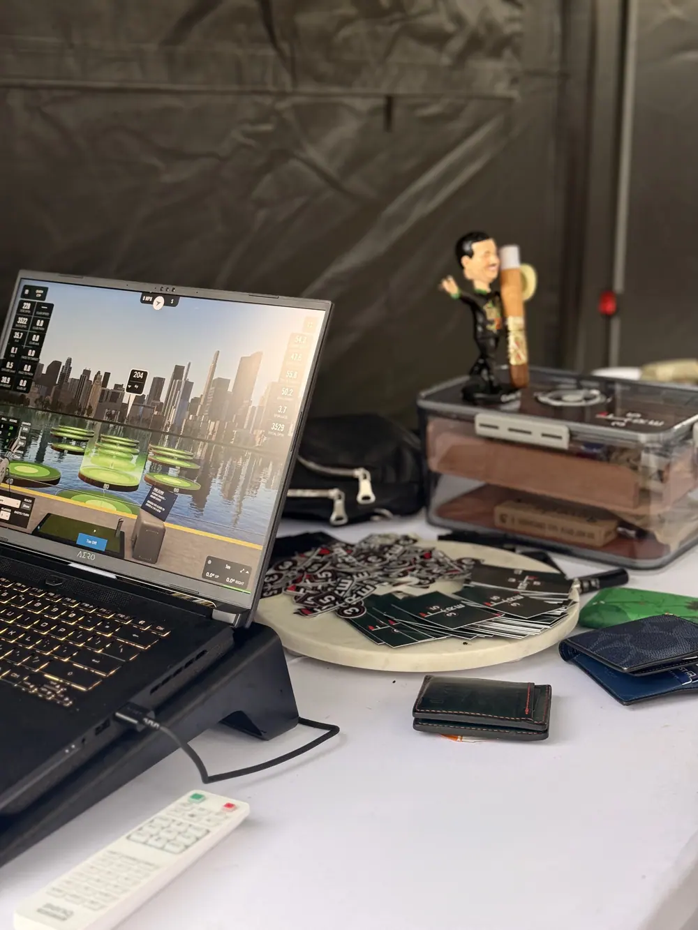 A laptop running the simulator software on the operator table beside the bay