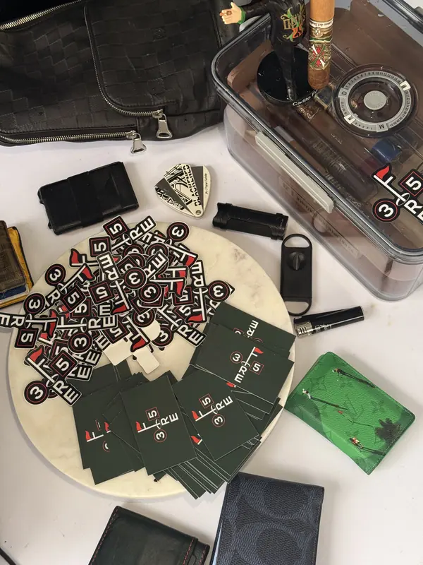 3Fore5 cards and the launch monitor laid out on a table