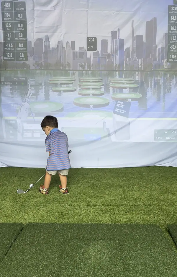 A young guest playing the island challenge game on the screen