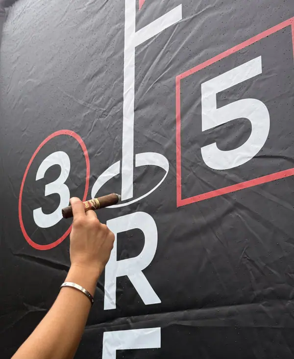 The 3Fore5 logo printed on the black canopy banner
